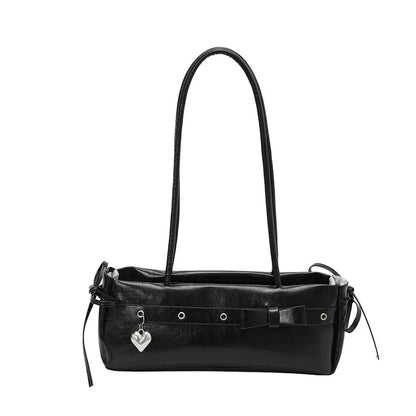 Bolsa baguete de alto estilo para mulheres, uma bolsa de ombro de couro fresca e versátil, uma bolsa moderna e versátil para mulheres jovens.